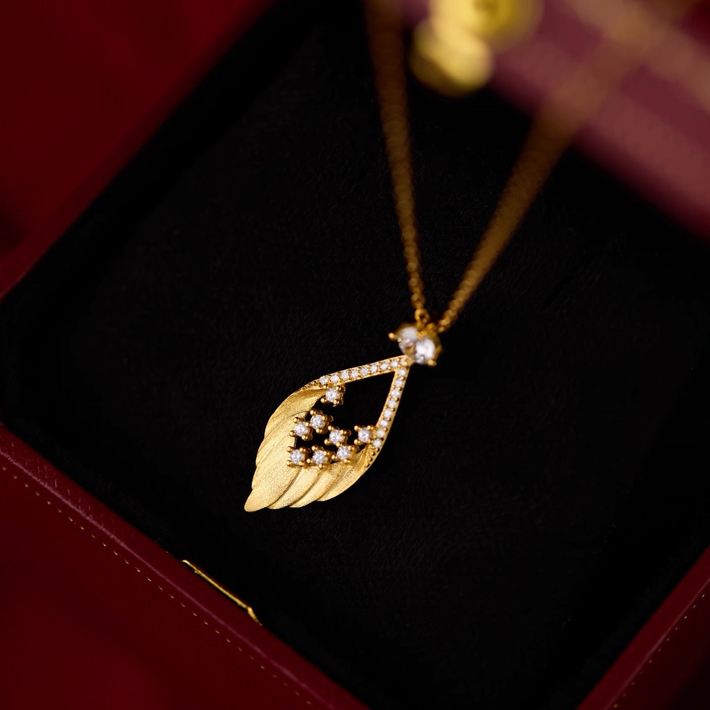 Golden Feather Spark Necklace